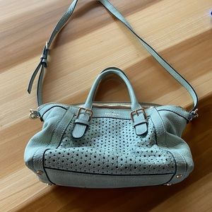 Kate spade teal colored bag. Not used much and no noticeable damages